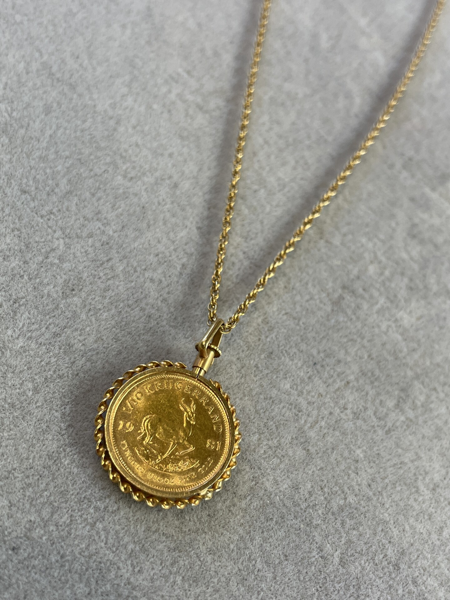 22k Kruger coin pendant at 18k necklace